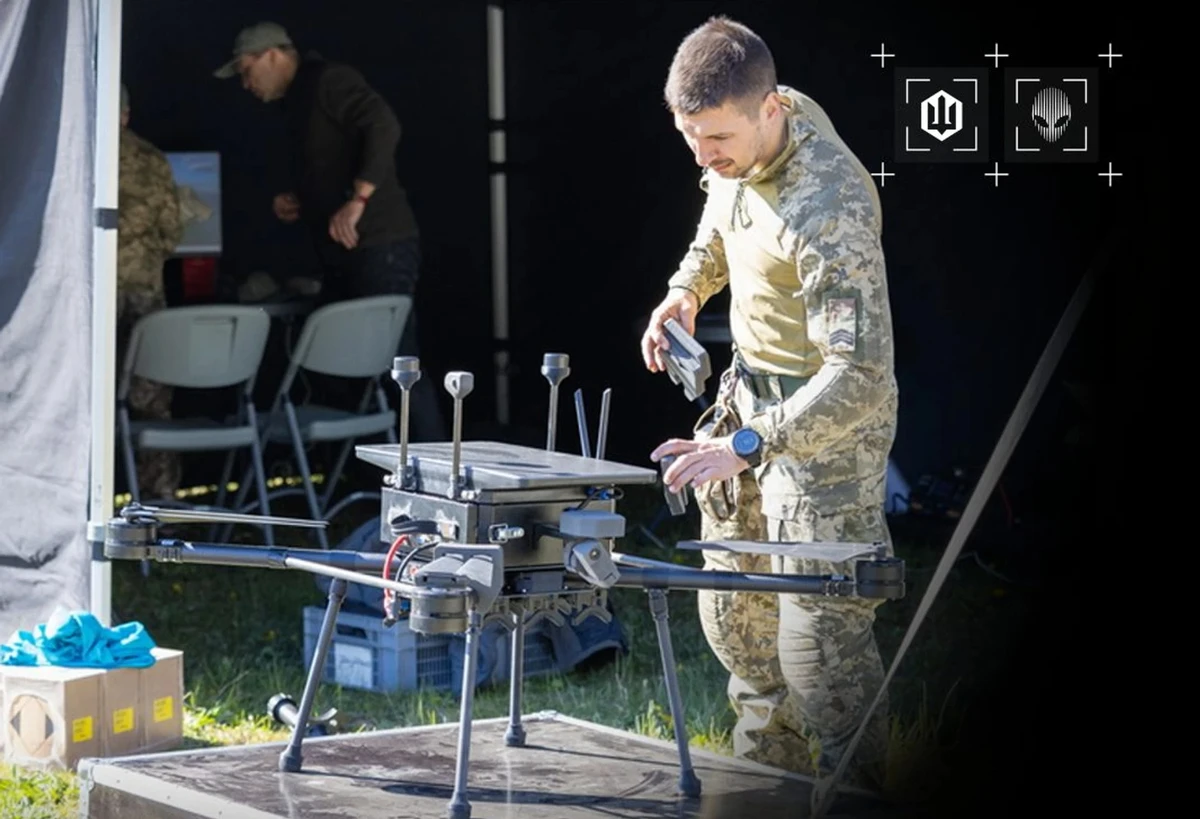 A Ukrainian drone operator prepares a copter drone for take-off during NATO exercises
