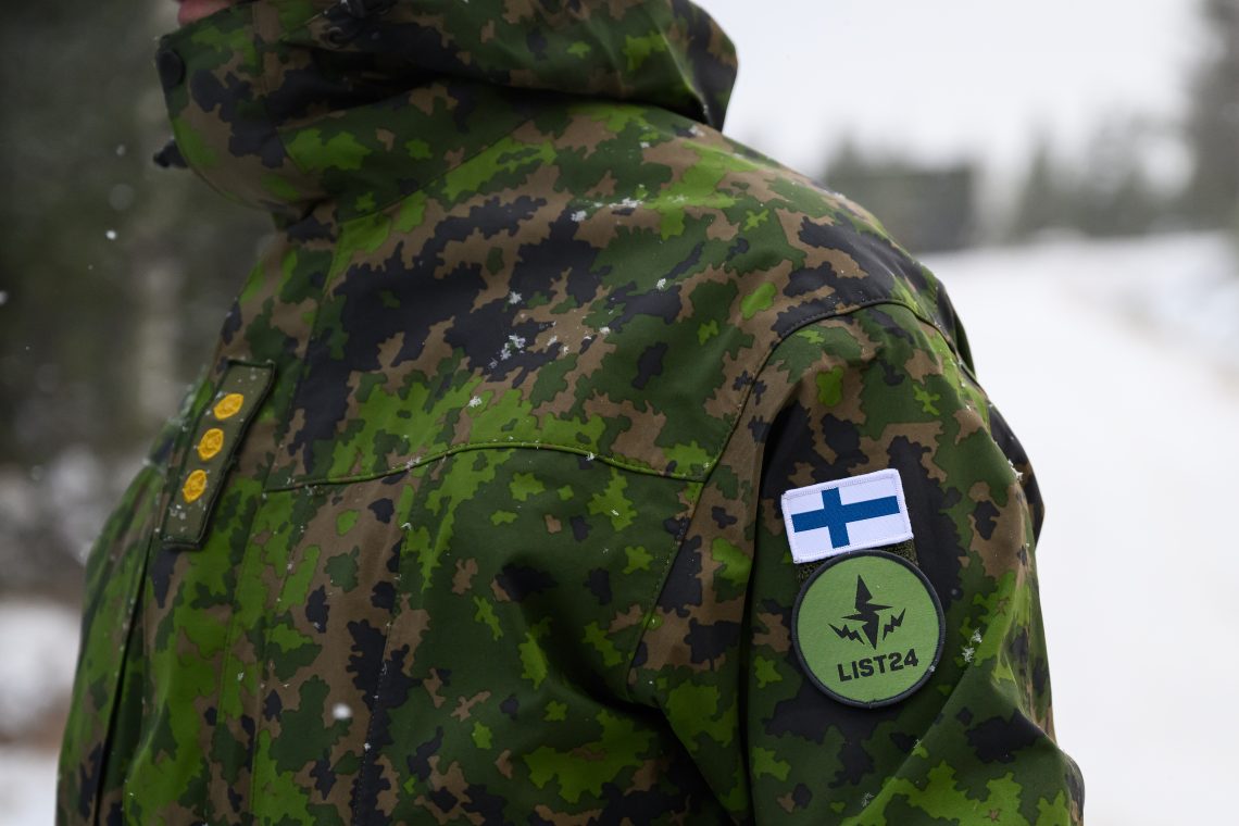 Nov. 20, 2024: A Finnish soldier wears the flag of Finland and the NATO "Exercise Lightning Strike" logo on his uniform on near Heinu, Finland. The live-fire exercises included service members from 28 allied and partner nations and took place across Finland, Estonia, Germany, Poland and Romania.