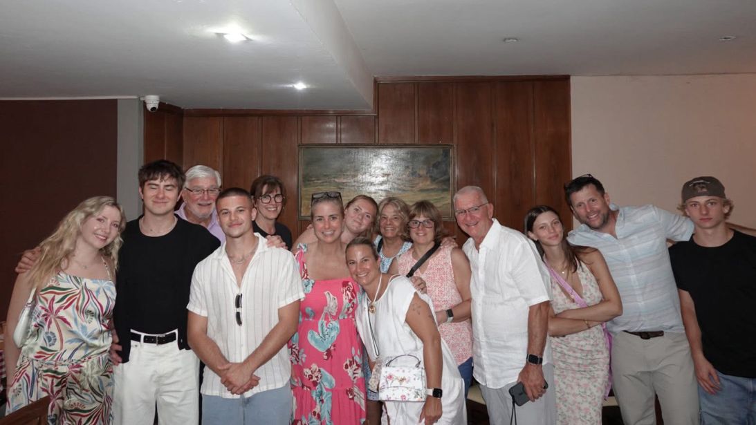 Liz Fitzgerald (center, in pink dress) and a group of family members gathered in Italy last year. Many are descendants of her great-grandfather, Angelo.