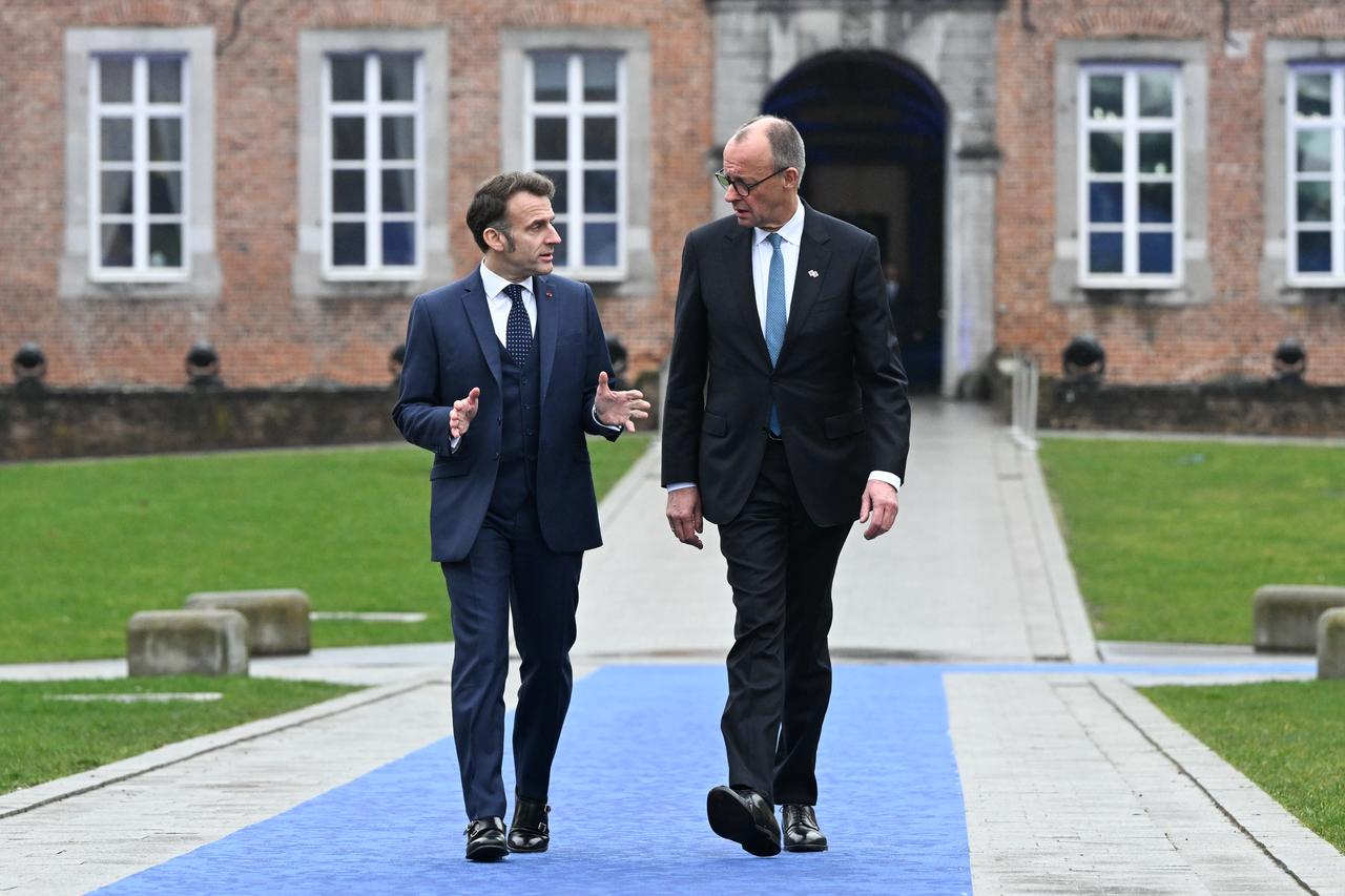 German Chancellor Friedrich Merz (R), French President Emmanuel Macron (L) attend the informal EU leaders' retreat in Alden Biesen, Flanders, Belgium, Feb. 12, 2026. (Photo via EU Council / Pool)