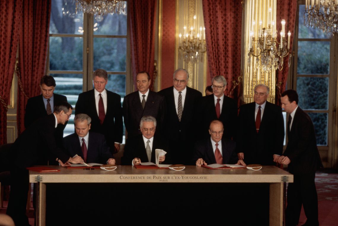 December 14, 1995: Serbian President Slobodan Milosevic, Croatian President Franjo Tudjman, and Bosnian President Alija Izetbegovic at a ceremonial signing of the Dayton Peace Agreement in the Palais de l’Elysee in Paris. The agreement, initially signed in Dayton, Ohio, ended the Bosnian war, which lasted from 1992 to 1995. 
