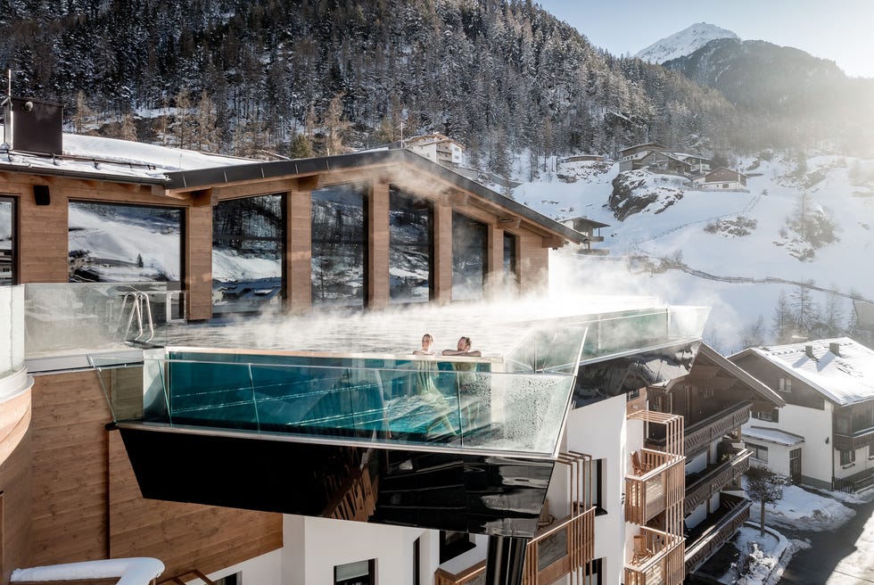 modern mountain resort with an outdoor heated pool