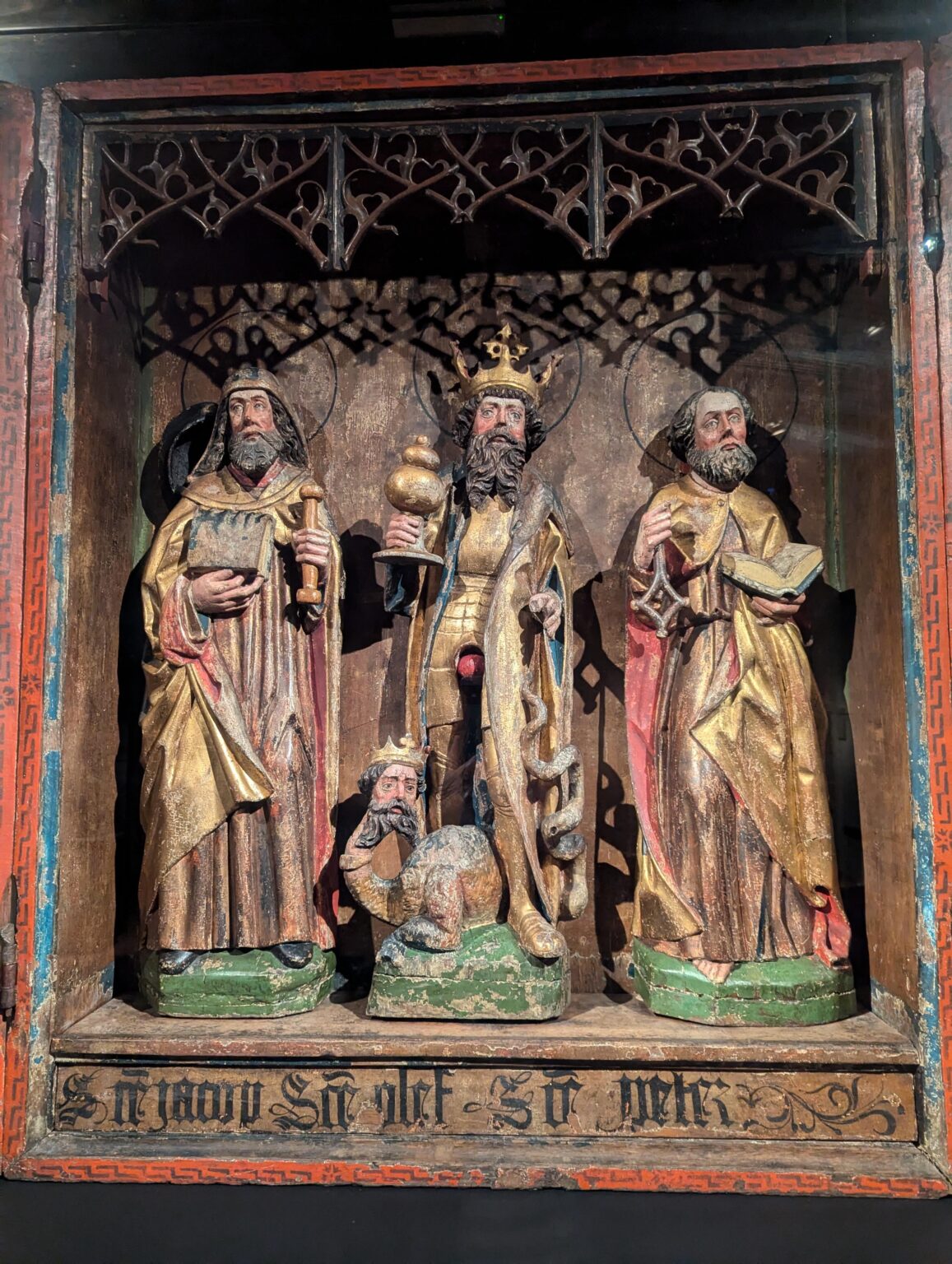 Altarpiece at Trondenes Historical Center: What IS that red thing between St. Olaf's legs?