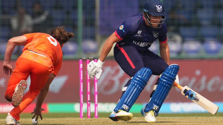 Netherlands' Bas de Leede, left, runs out Namibia's Ruben Trumpelmann during the T20 World Cup cricket match.