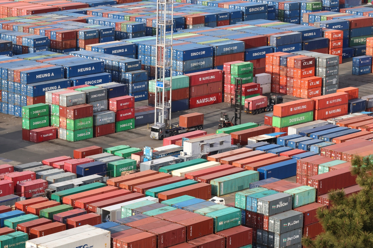 Containers awaiting shipment are stacked at a port in Busan on Wednesday. (Yonhap)