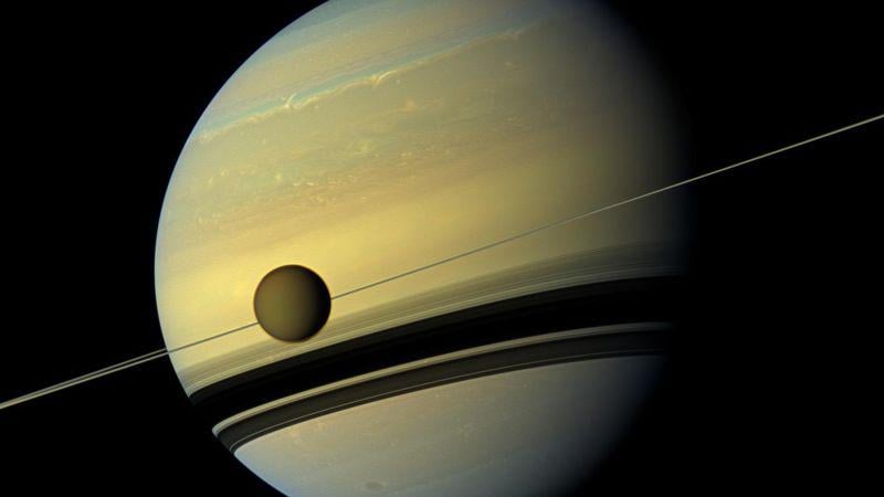 Saturn’s rings and largest moon may have formed after a cosmic collision, astronomers say