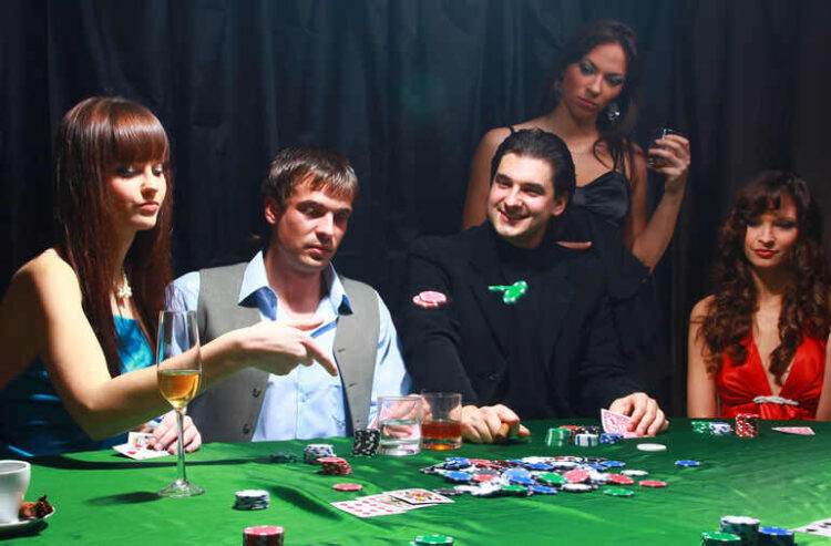 A group of stylish young adults playing poker at a casino table, surrounded by colorful chips, cards, and drinks, capturing the excitement of gambling entertainment in Europe.