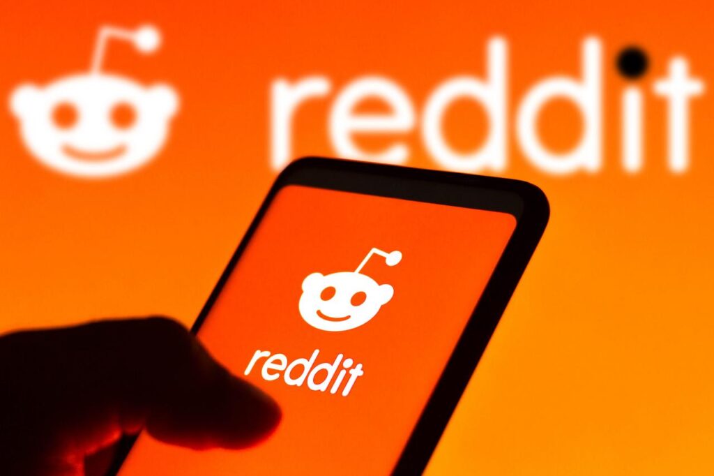 Photo illustration displays the Reddit logo on a smartphone screen with the platform’s logo shown in the background in Brazil, Dec. 21, 2021. (Adobe Stock Photo)