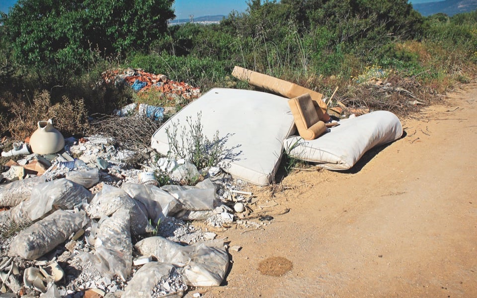 Discarded street mattresses pile up, awaiting action
