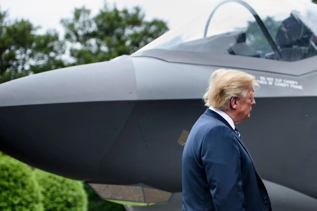 The image shows U.S. President Donald Trump standing next to the nose of an F-35 fighter jet, accessed on Feb. 17, 2026. (AFP Photo)
