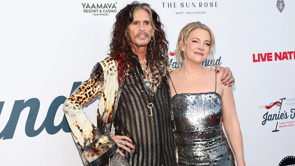 Steven Tyler and Melissa Joan Hart on red carpet at 7th Annual Jam For Janie GRAMMY Awards Viewing Party at Hollywood Palladium on February 01, 2026 in Los Angeles, California.