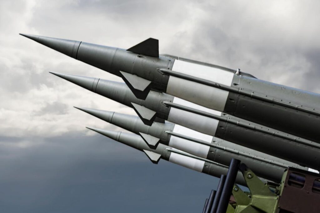 Nuclear missiles with warheads aimed at gloomy sky, date and time undisclosed. (Adobe Stock Photo)