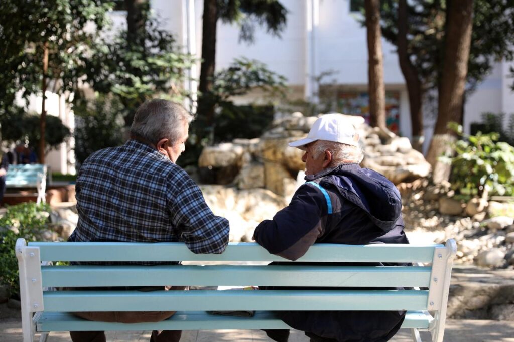 Two residents of Darulaceze nursing home chat in Istanbul, Türkiye, Oct. 1, 2020. (AA Photo)