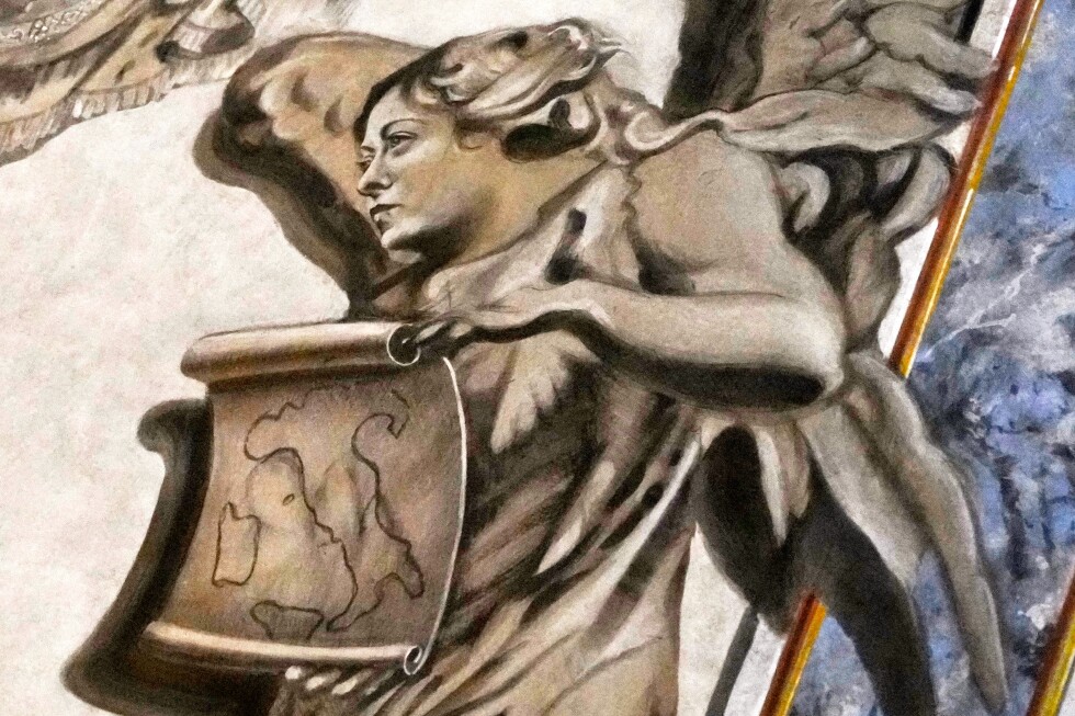 The face of a cherub resembling Italian Premier Giorgia Meloni is painted over