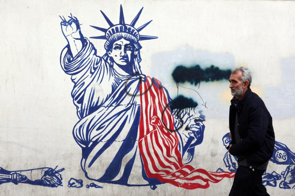 US imposes sanctions on Iran as both sides agree to continue nuclear talks A man walks past a mural depicting the US Statue of Liberty with the torch-bearing arm broken, painted on the outer walls of the former US embassy, in Tehran on Feb. 6, 2026. (AFP Photo)