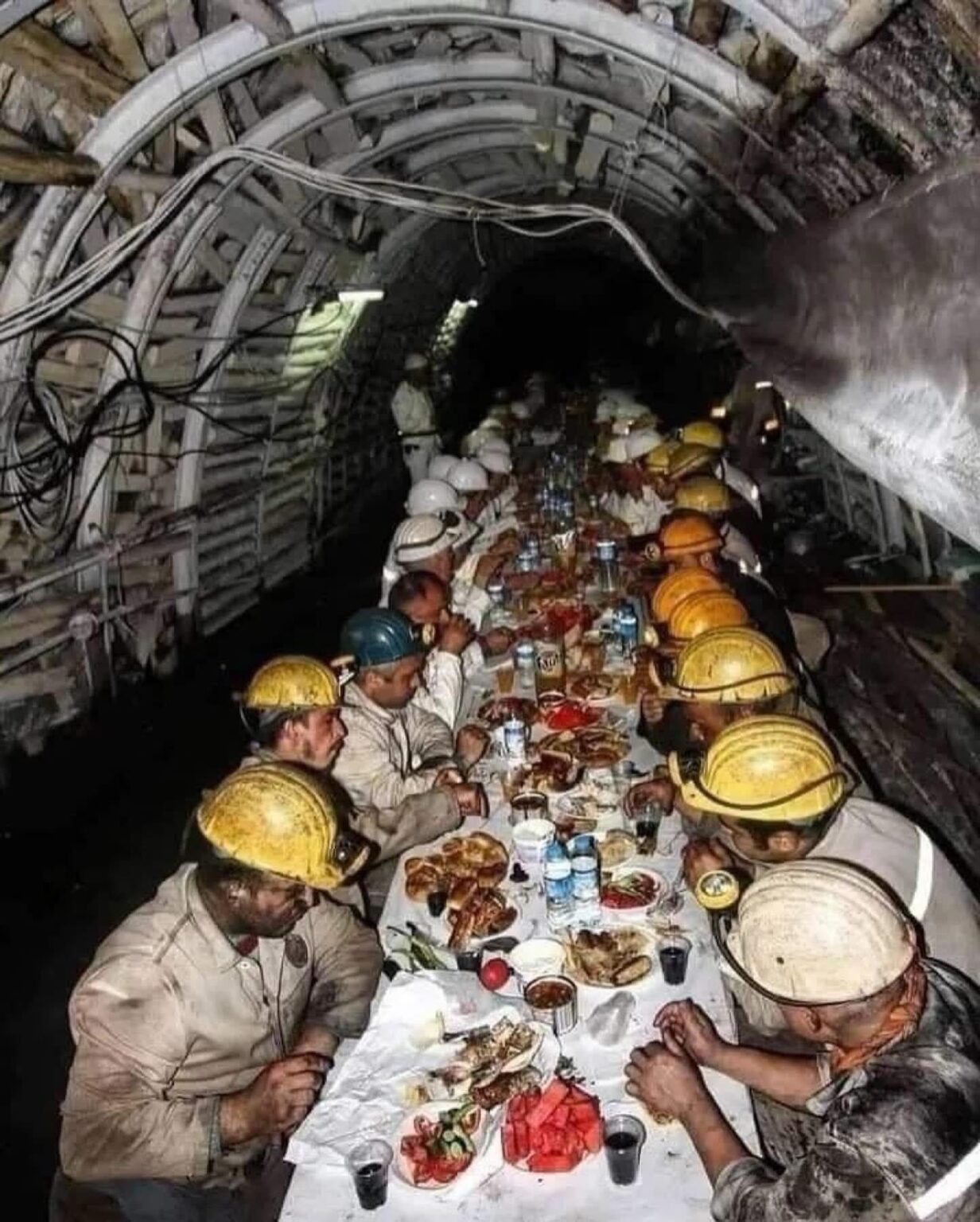 Bosnian miners breaking for Iftar dinner underground, 2017