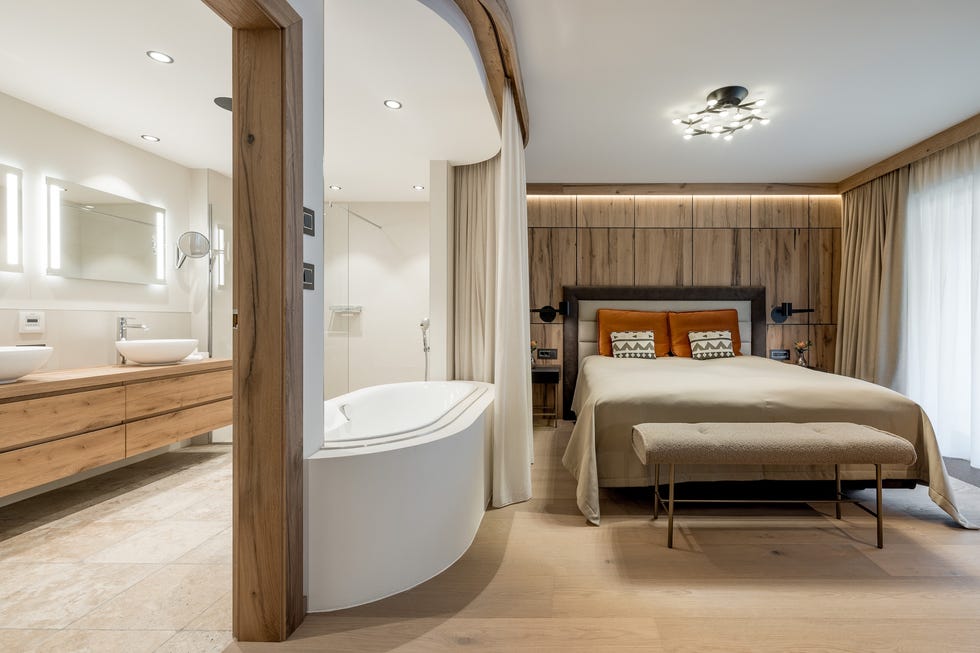 modern hotel room with an adjoining bathroom
