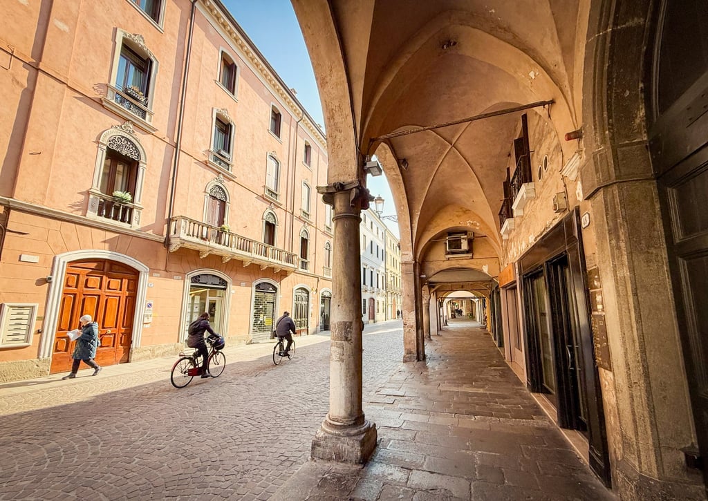 Padua’s narrow streets are lined with the survivors from a 14th century building boom and, unlike Venice, half an hour away, its shops are devoted more to everyday-life services than to tourist souvenirs. Photo: Peter Neville-Hadley