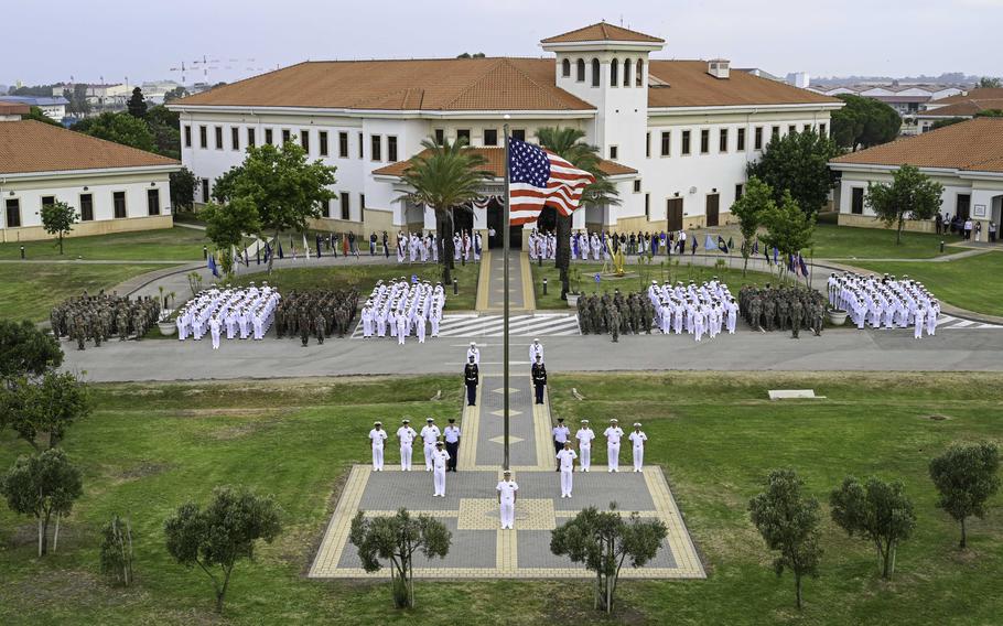 Troops stand in formation.