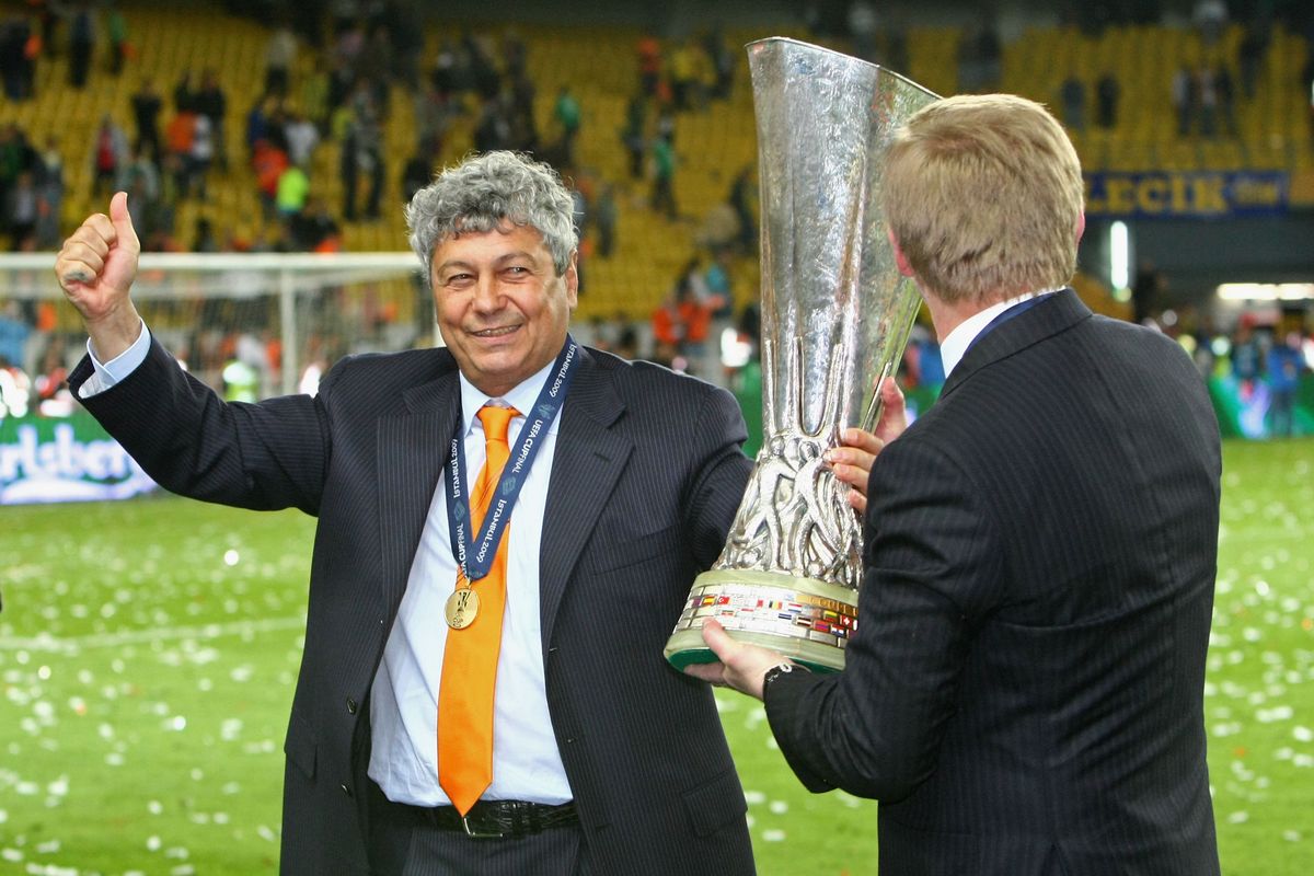 ISTANBUL, TURKEY - MAY 20:  Shakhtar Donetsk owner Rinat Akhmetov (R) and Coach Mircea Lucescu  celebrate with the trophy following their team's victory after extra time at the end of the UEFA Cup Final between Shakhtar Donetsk and Werder Bremen at the Sukru Saracoglu Stadium on May 20, 2009 in Istanbul, Turkey. (Photo by Martin Rose/Bongarts/Getty Images)