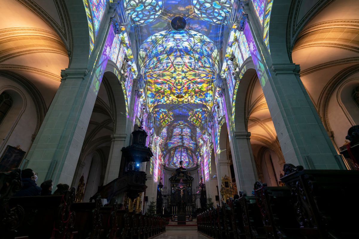 A psychedelic light show transforms the beautiful baroque Jesuit Church in Switzerland’s Catholic city into a virtual reality world