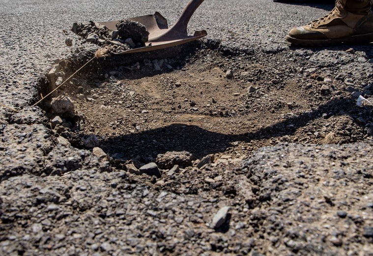 How A Cold Winter Turned Local Roads Into Swiss Cheese