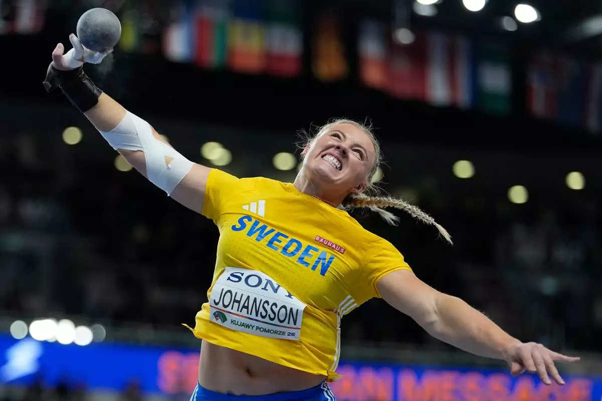Axelina Johansson, of Sweden, competes in the women's shot put final at the World Athletics Indoor Championships in Torun, Poland, Friday, March 20, 2026. (AP Photo/Matthias Schrader)