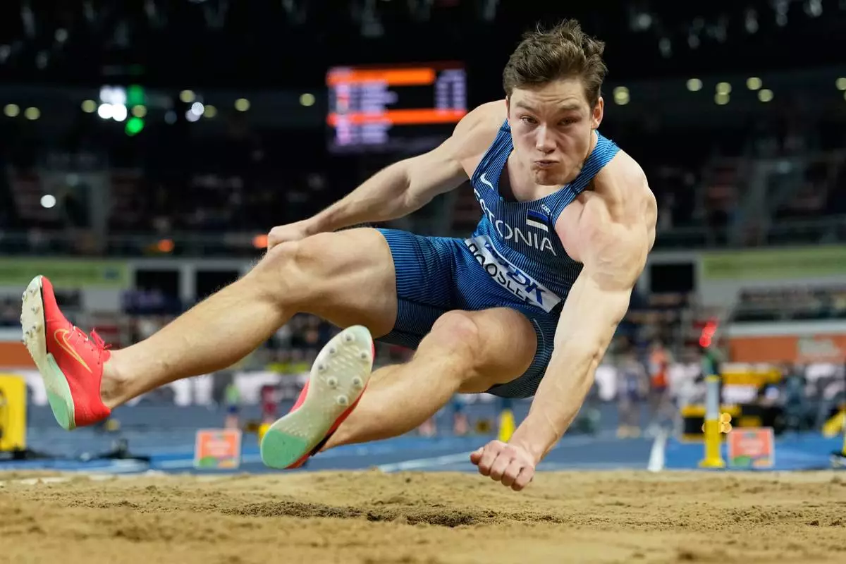 Rasmus Roosleht, of Estonia, competes in the heptathlon long jump at the World Athletics Indoor Championships in Torun, Poland, Friday, March 20, 2026. (AP Photo/Matthias Schrader)