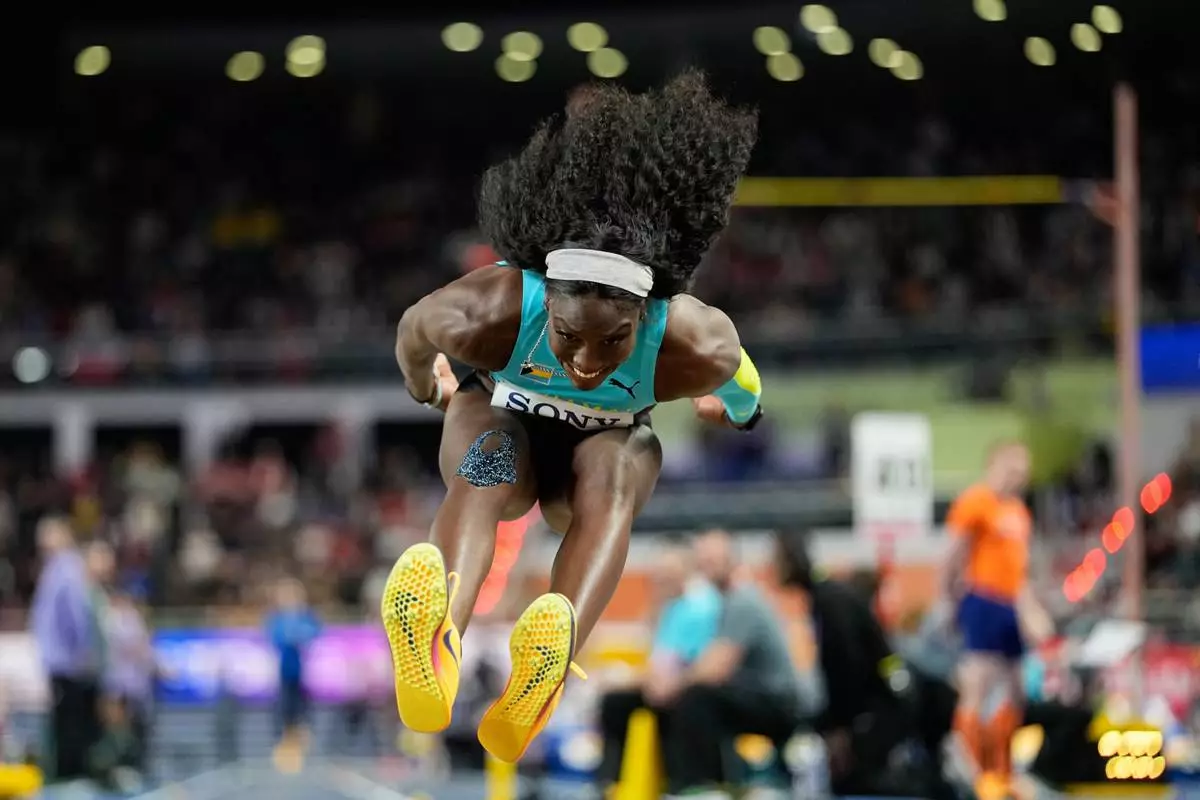 Charisma Taylor, of Bahamas, makes an attempt in the women's triple jump final at the World Athletics Indoor Championships in Torun, Poland, Saturday, March 21, 2026. (AP Photo/Matthias Schrader)