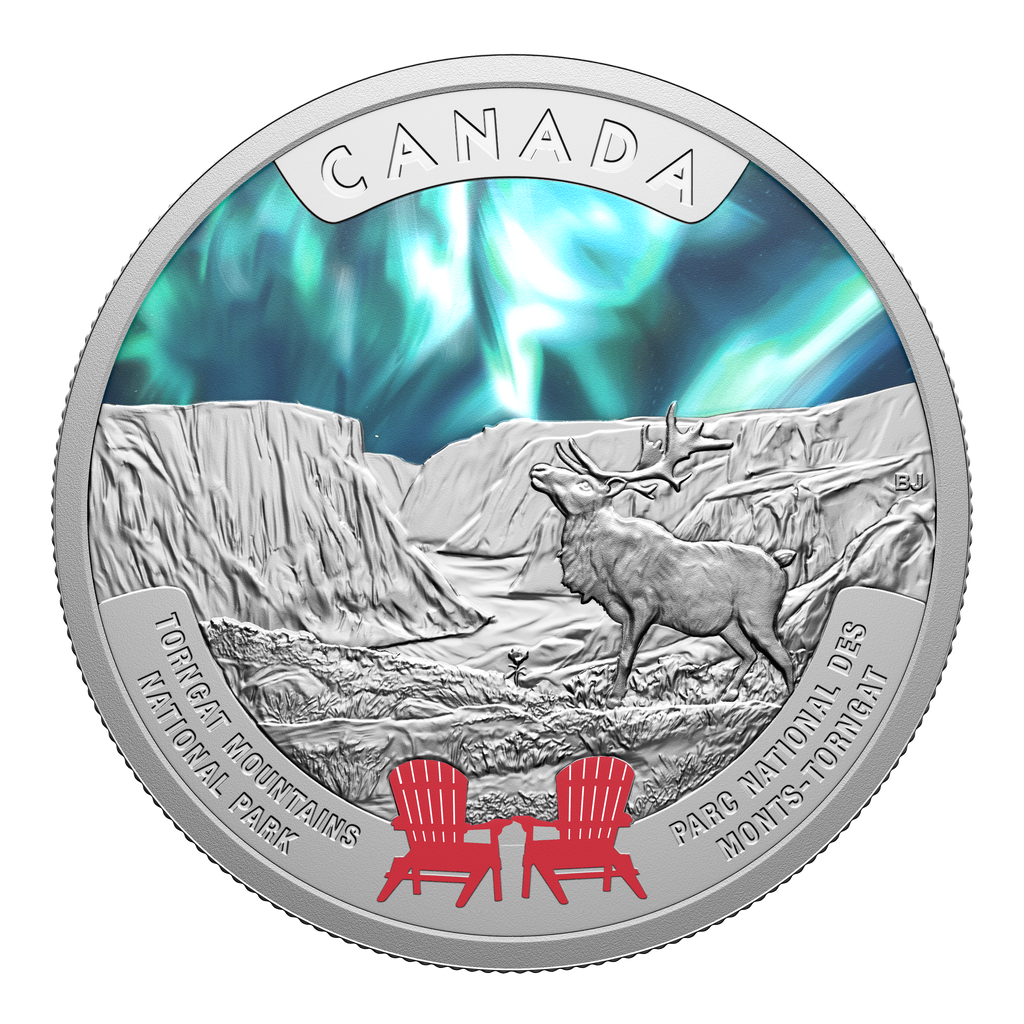 A round coin with northern lights, mountains and a caribou. There are two deck chairs in red at the bottom.