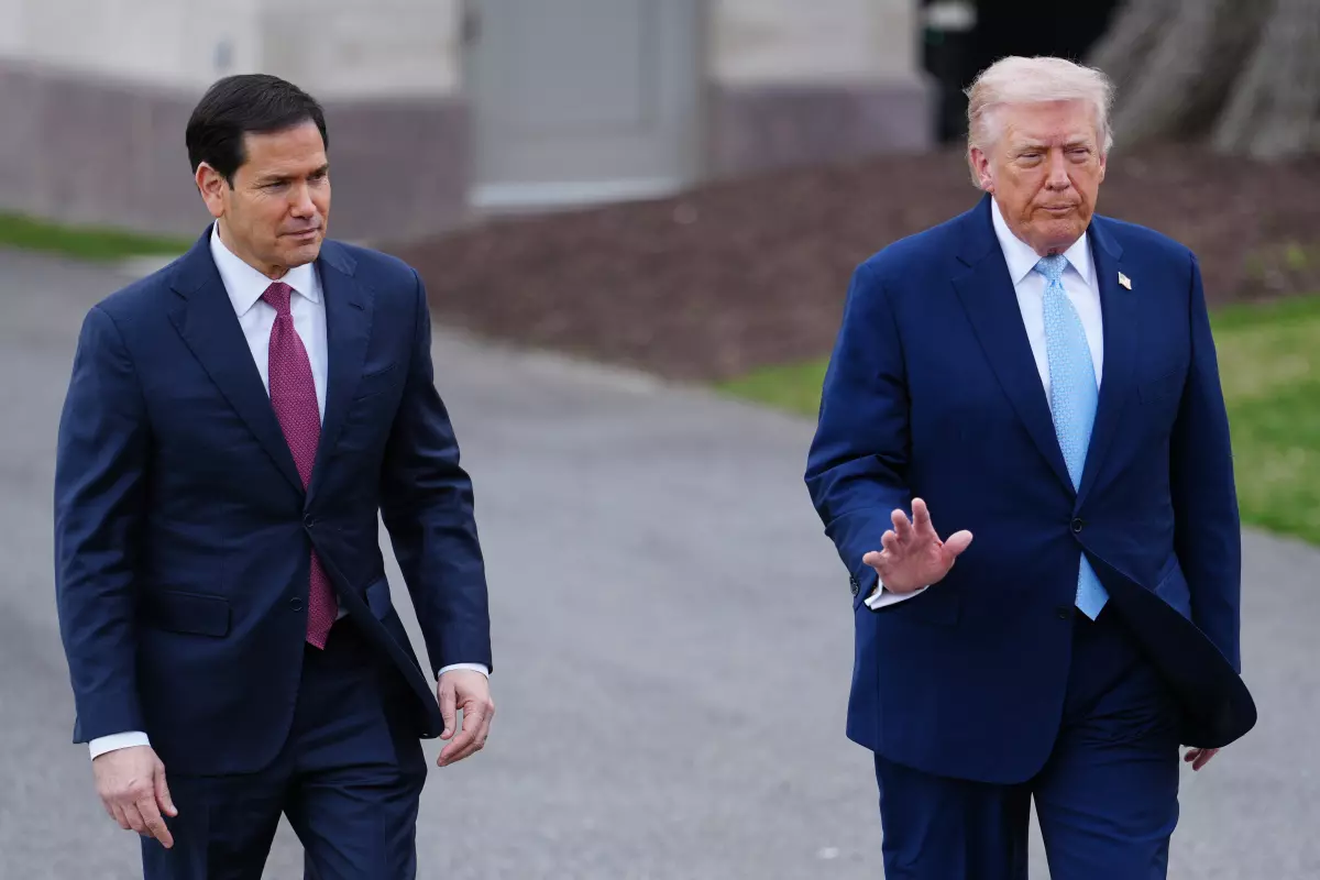 President Donald Trump walks with Secretary of State Marco Rubio to speak with reporters before departing on Marine One from the South Lawn of the White House, Friday, March 20, 2026, in Washington.