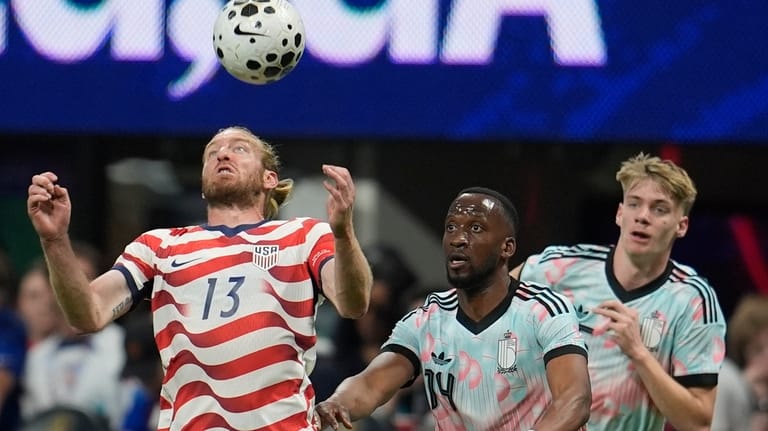 United States' Tim Ream (13) tries the control the ball...