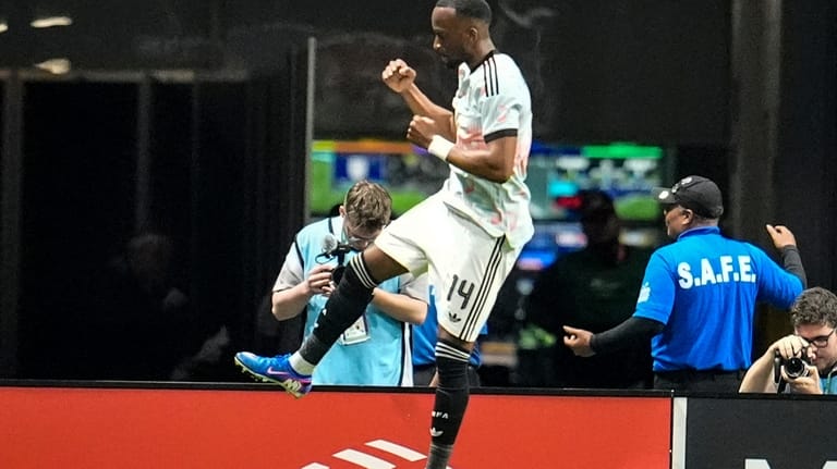 Belgium's Dodi Lukebakio celebrates his goal against the United States...