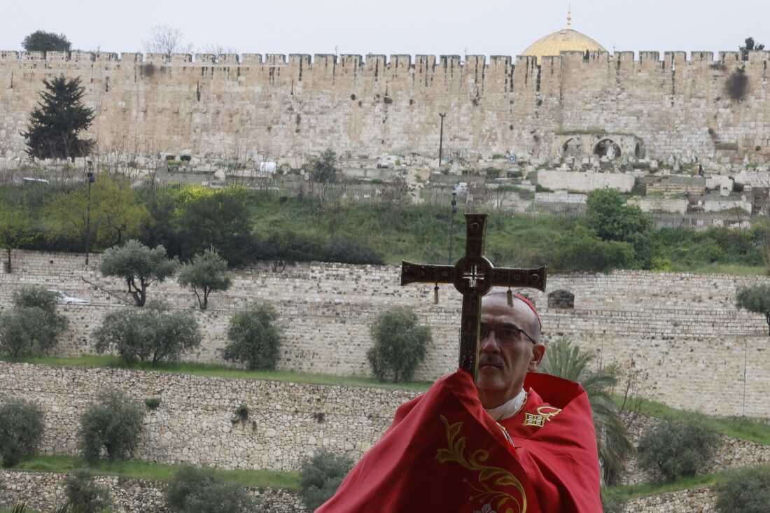 Latin Patriarch of Jerusalem, Cardinal Pierbattista Pizzaballa, leads a prayer service to mark Palm Sunday in Jerusalem on Sunday, following the cancellation of the traditional Palm Sunday procession from the Mount of Olives amid restrictions on gathering in large groups and the U.S.-Israeli war on Iran.