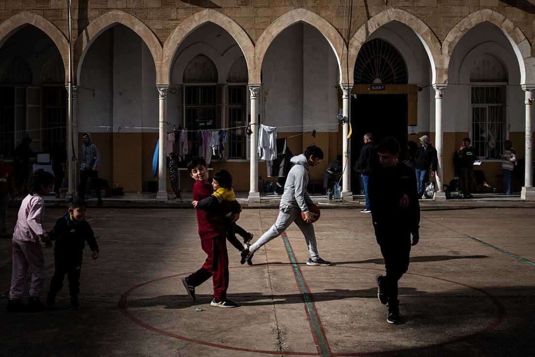 Children play in the courtyard of a school that has been turned into a temporary displacement camp on in Beirut, Sunday.