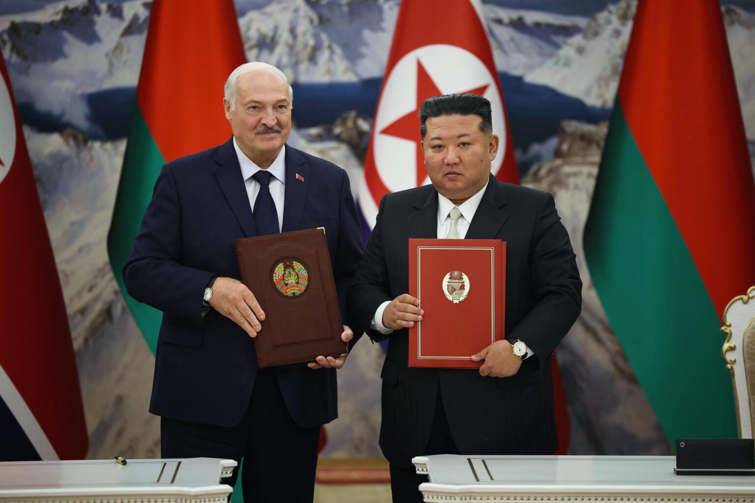 N. Korea’s Kim says ties with Belarus will advance briskly in reply to Lukashenko Belarusian President Alexander Lukashenko and North Korean leader Kim Jong-un hold signed documents during a meeting in Pyongyang, North Korea, March 26, in this photo from the Belarusian presidential press service. EPA-Yonhap