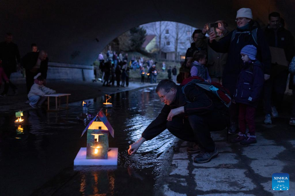 People release floats on stream to celebrate arrival of spring in Ljubljana, Slovenia-Xinhua