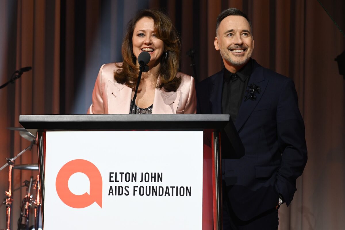 WEST HOLLYWOOD, CALIFORNIA - MARCH 12: (L-R) Anne Aslett, CEO of EJAF and David Furnish speak onstage during the Elton John AIDS Foundation's 31st Annual Academy Awards Viewing Party on March 12, 2023 in West Hollywood, California. (Photo by Michael Kovac/Getty Images for Elton John AIDS Foundation)