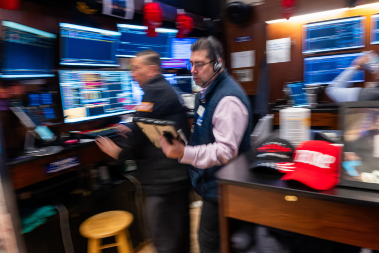 Traders work on the floor of the New York Stock Exchange (NYSE) on March 9, 2026 in New York City.