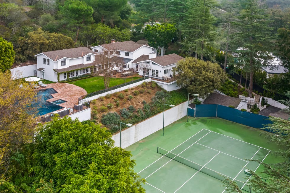 Residential property with a tennis court and pool