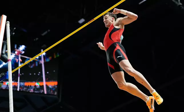Simon Ehammer, of Switzerland, reacts after a successful attempt in the heptathlon pole vault at the World Athletics Indoor Championships in Torun, Poland, Saturday, March 21, 2026. (AP Photo/Matthias Schrader)