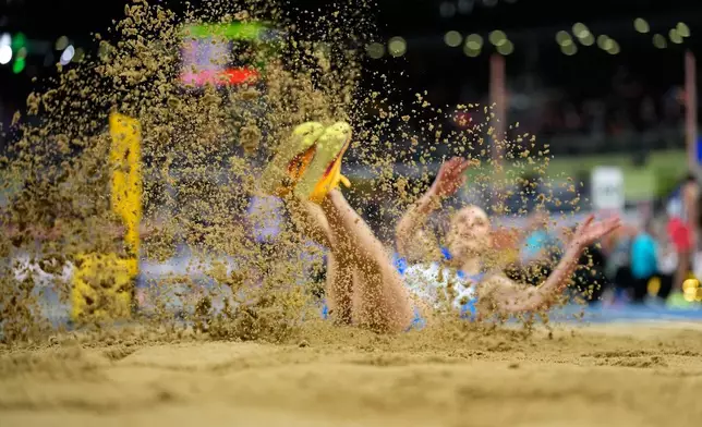 Ivana Spanovic, of Serbia, makes an attempt in the women's triple jump final at the World Athletics Indoor Championships in Torun, Poland, Saturday, March 21, 2026. (AP Photo/Matthias Schrader)