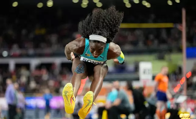 Charisma Taylor, of Bahamas, makes an attempt in the women's triple jump final at the World Athletics Indoor Championships in Torun, Poland, Saturday, March 21, 2026. (AP Photo/Matthias Schrader)