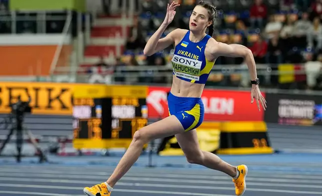 Yaroslava Mahuchikh, of Ukraine, competes during the women's high jump final at the World Athletics Indoor Championships in Torun, Poland, Friday, March 20, 2026. (AP Photo/Matthias Schrader)