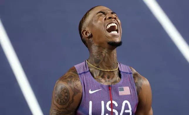 Jordan Anthony, of the United States, reacts after crossing the finish line to win the gold medal in the men's 60 meters final at the World Athletics Indoor Championships in Torun, Poland, Friday, March 20, 2026. (AP Photo/Beata Zawrzel)