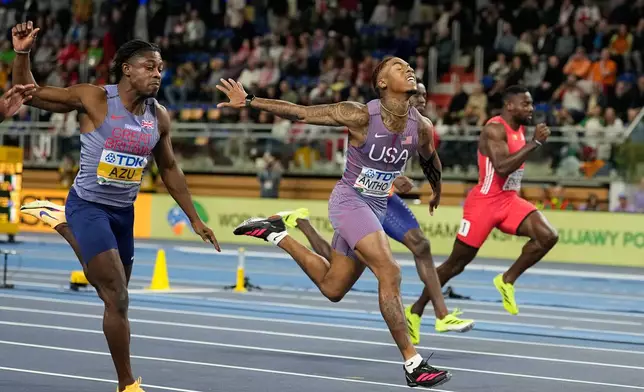 Jordan Anthony, of the United States, wins the men's 60 meters final at the World Athletics Indoor Championships in Torun, Poland, Friday, March 20, 2026. (AP Photo/Matthias Schrader)