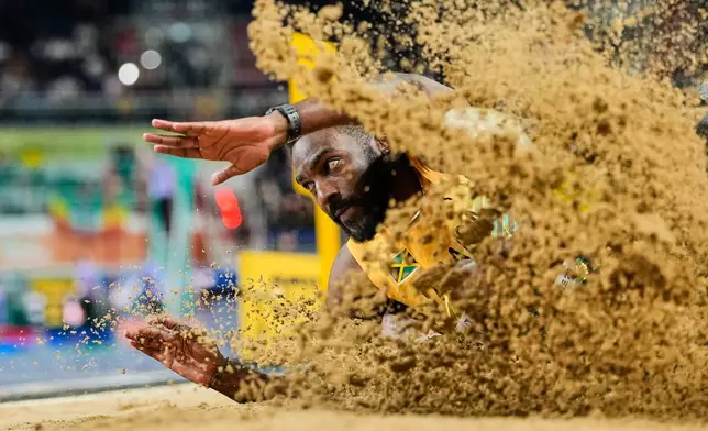 Jordan Scott, of Jamaica, competes during the men's triple jump final at the World Athletics Indoor Championships in Torun, Poland, Friday, March 20, 2026. (AP Photo/Matthias Schrader)
