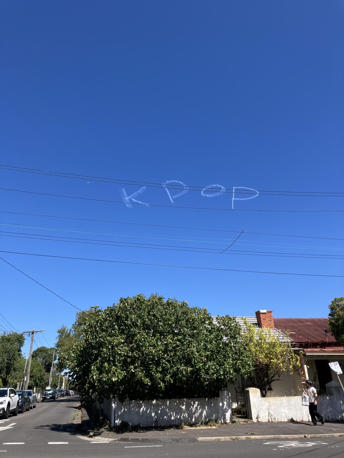 Skywriting over the city, from Northcote. Context, anyone?