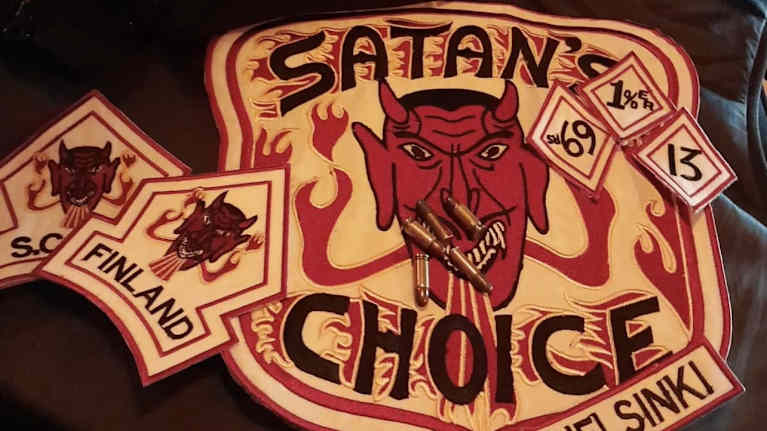 Screengrab of an Instagram post showing a patch with a cartoonish devil's face, the words Devil's Choice and several bullets on top of it.