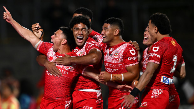 Tonga players celebrate a try in their upset win over New Zealand to reach the Pacific Championships rugby league final in 2024.